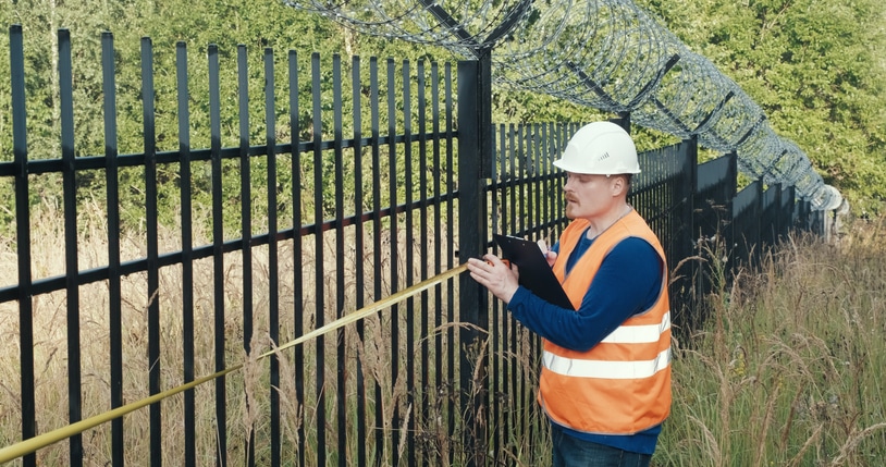 Fence with barbed wire