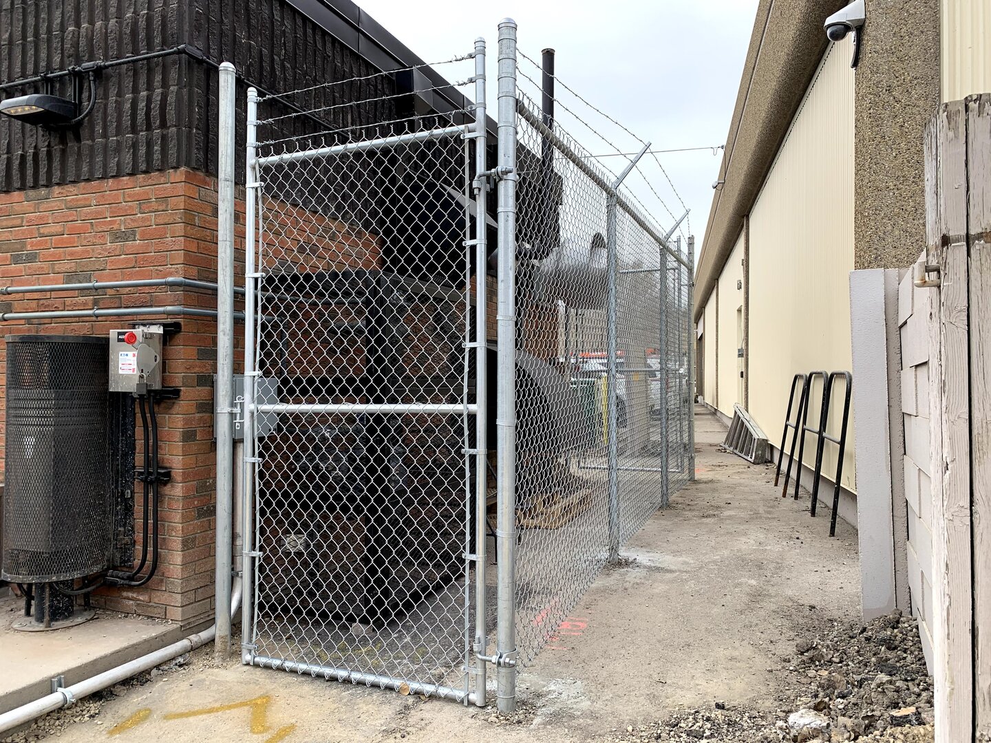 Commercial chain link fence with barbed wire