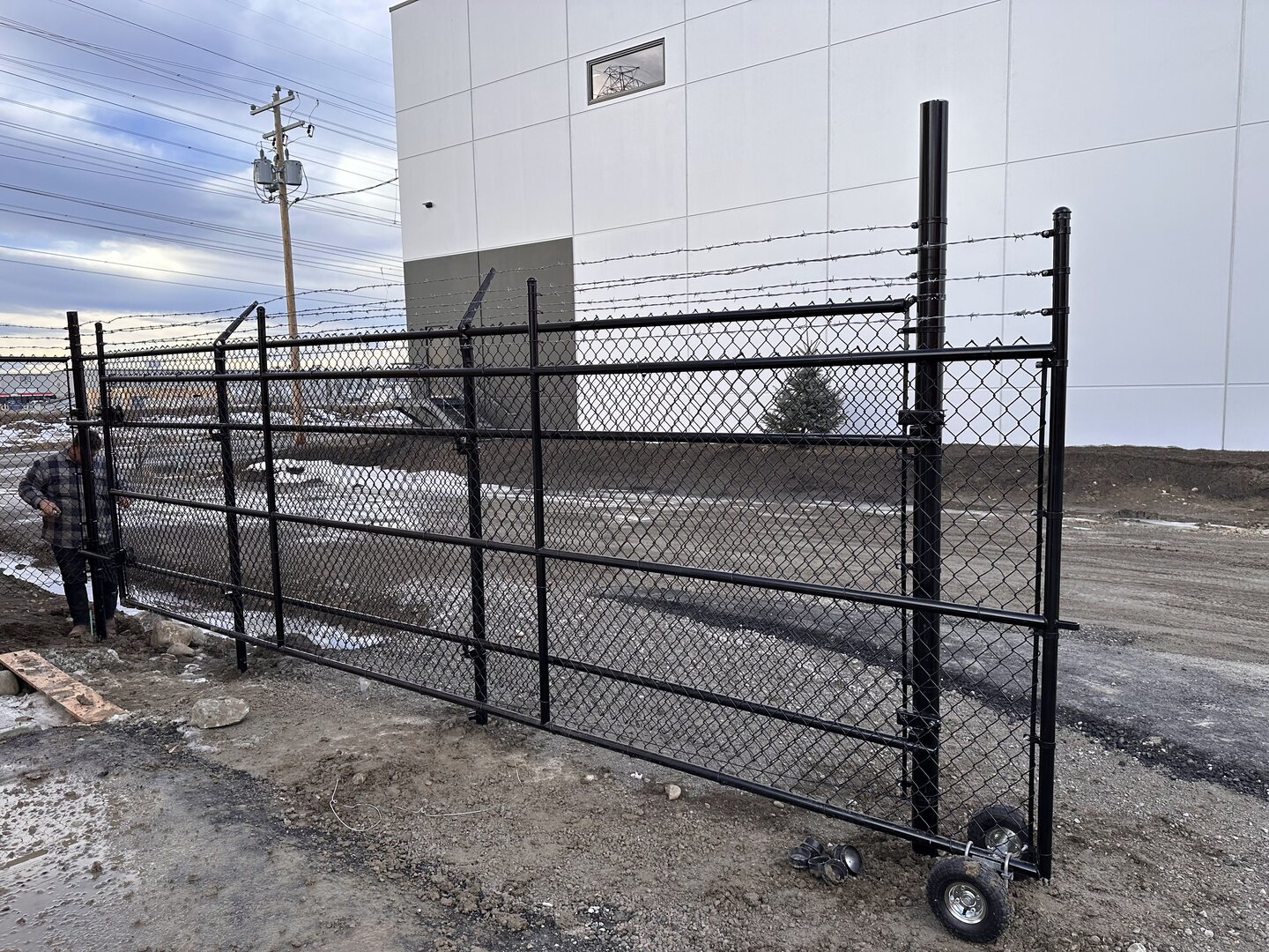 Commercial chain link fence with a cantilever gate