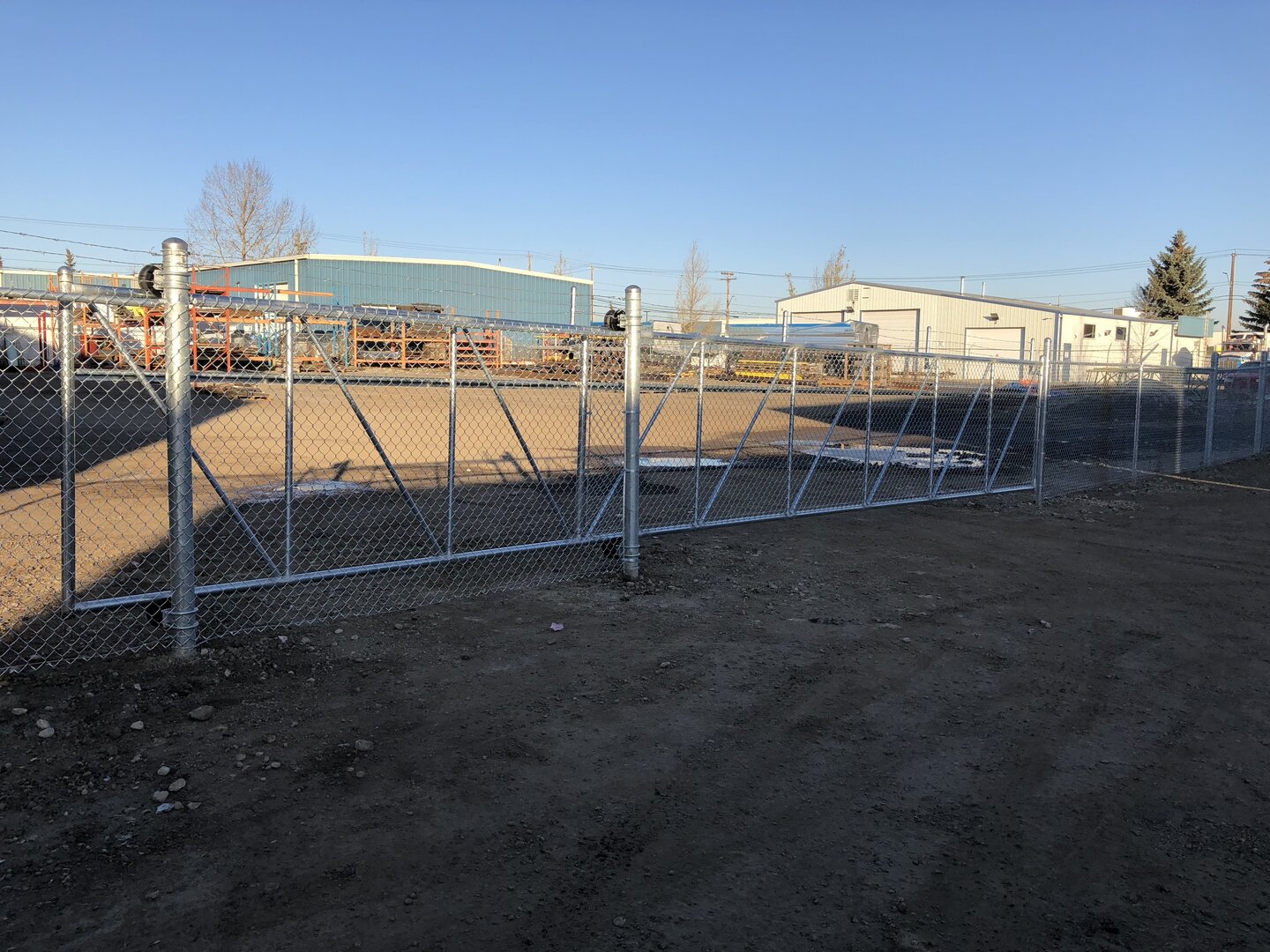 Commercial chain link fence with cantilever gate
