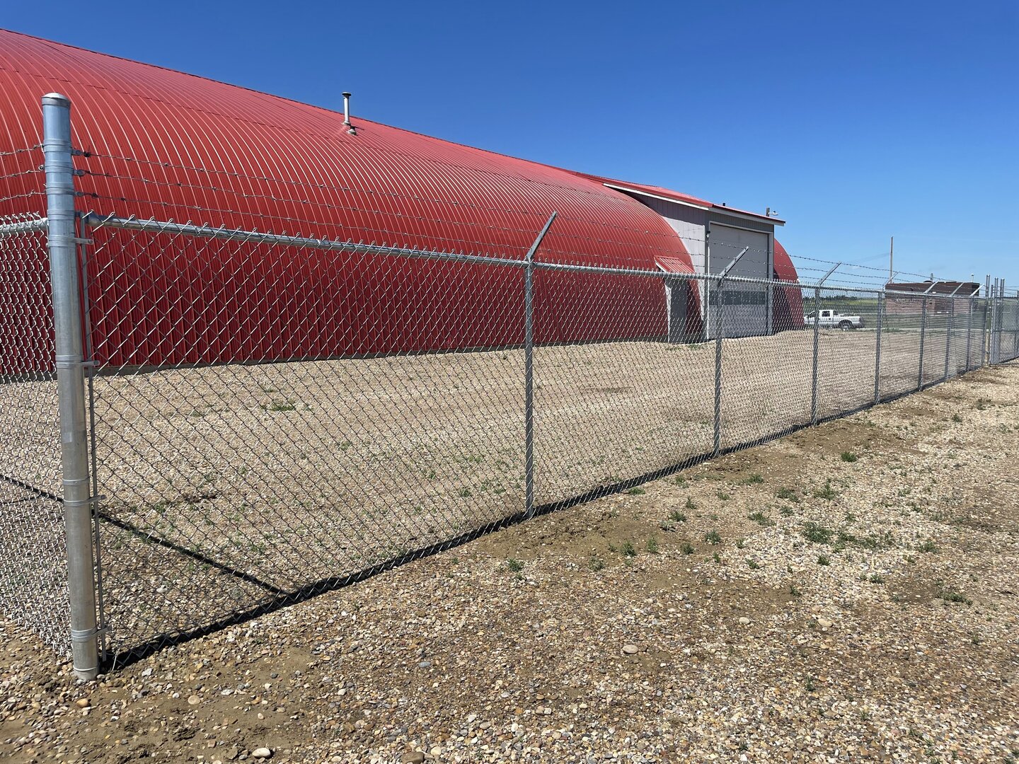 Commercial chain link fence with barbed wire