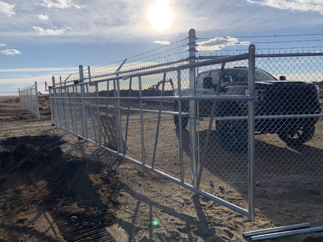 Commercial chain link fence with cantilever gate