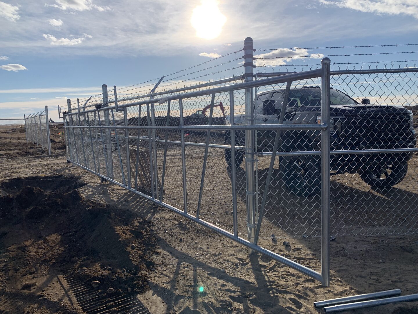 Commercial chain link fence with cantilever gate