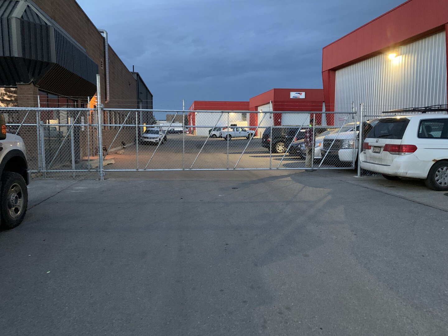 Commercial chain link fence with cantilever gate