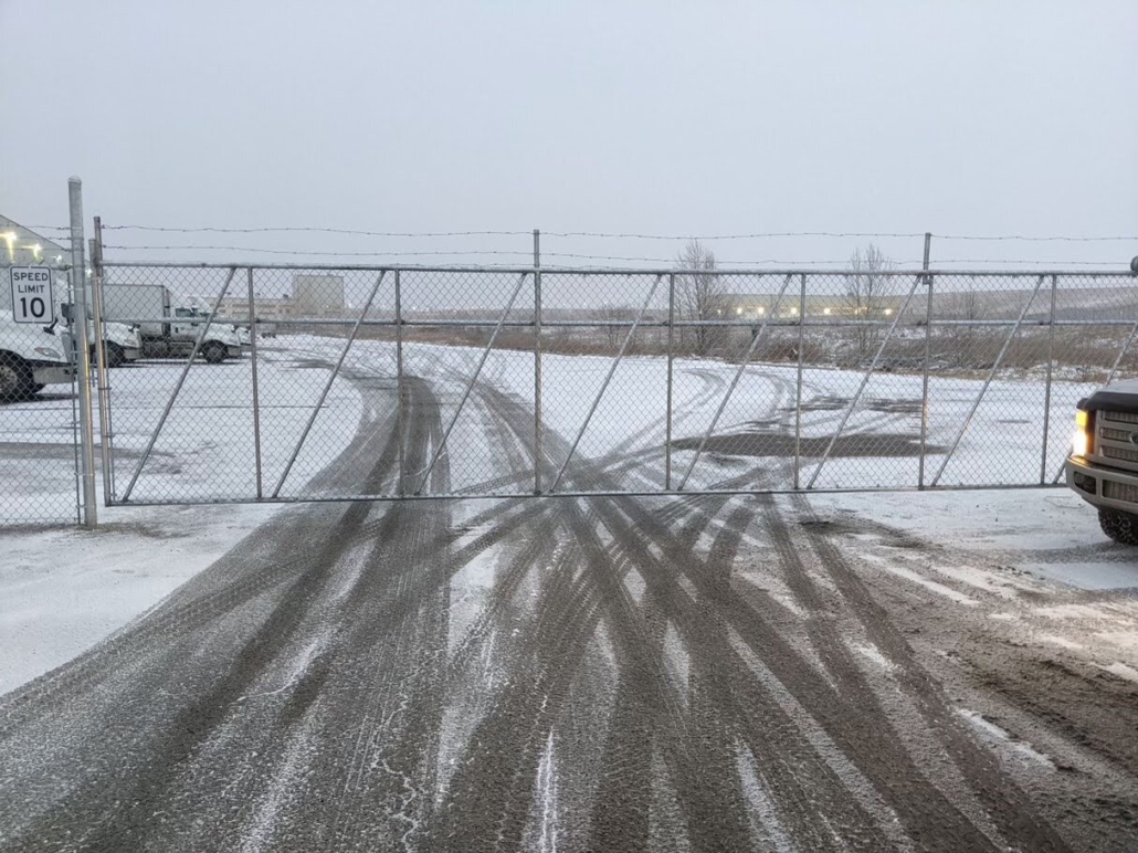 Commercial chain link fence with barbed wire