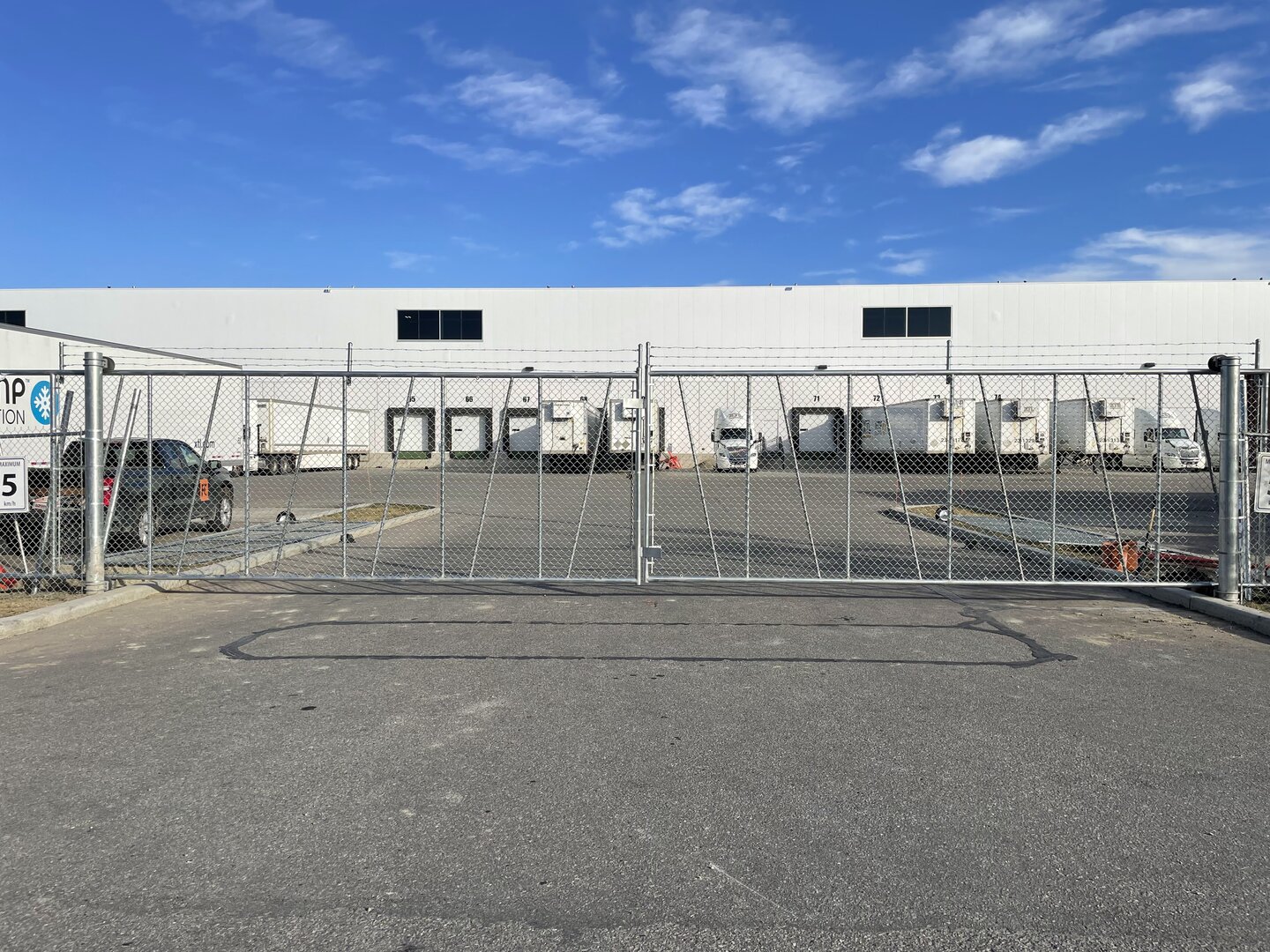 Commercial chain link fence with a cantilever gate
