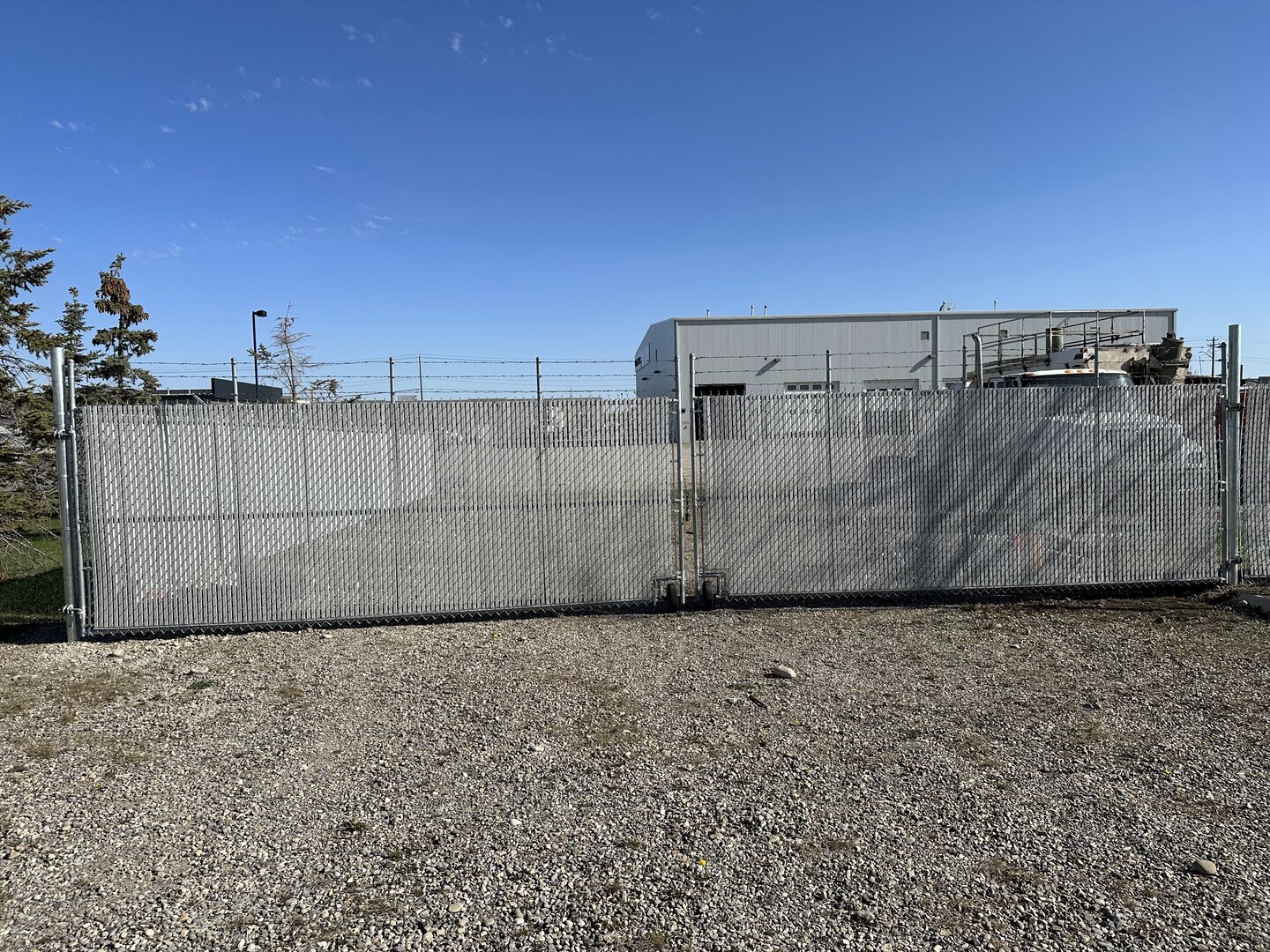 Commercial chain link fence with barbed wire